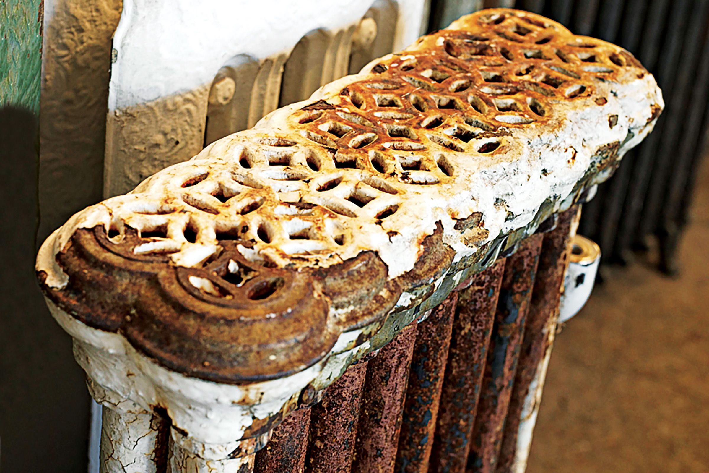 An old and rusty vintage radiator that is no longer in use.