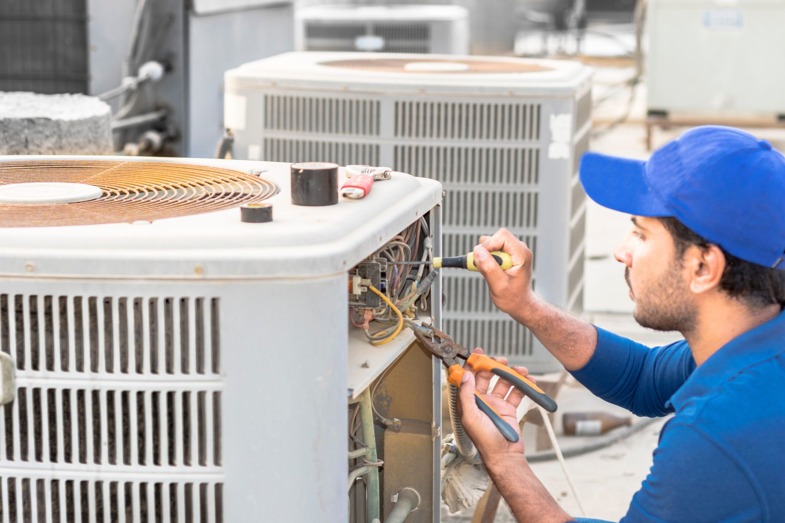 an HVAC technician working on a system