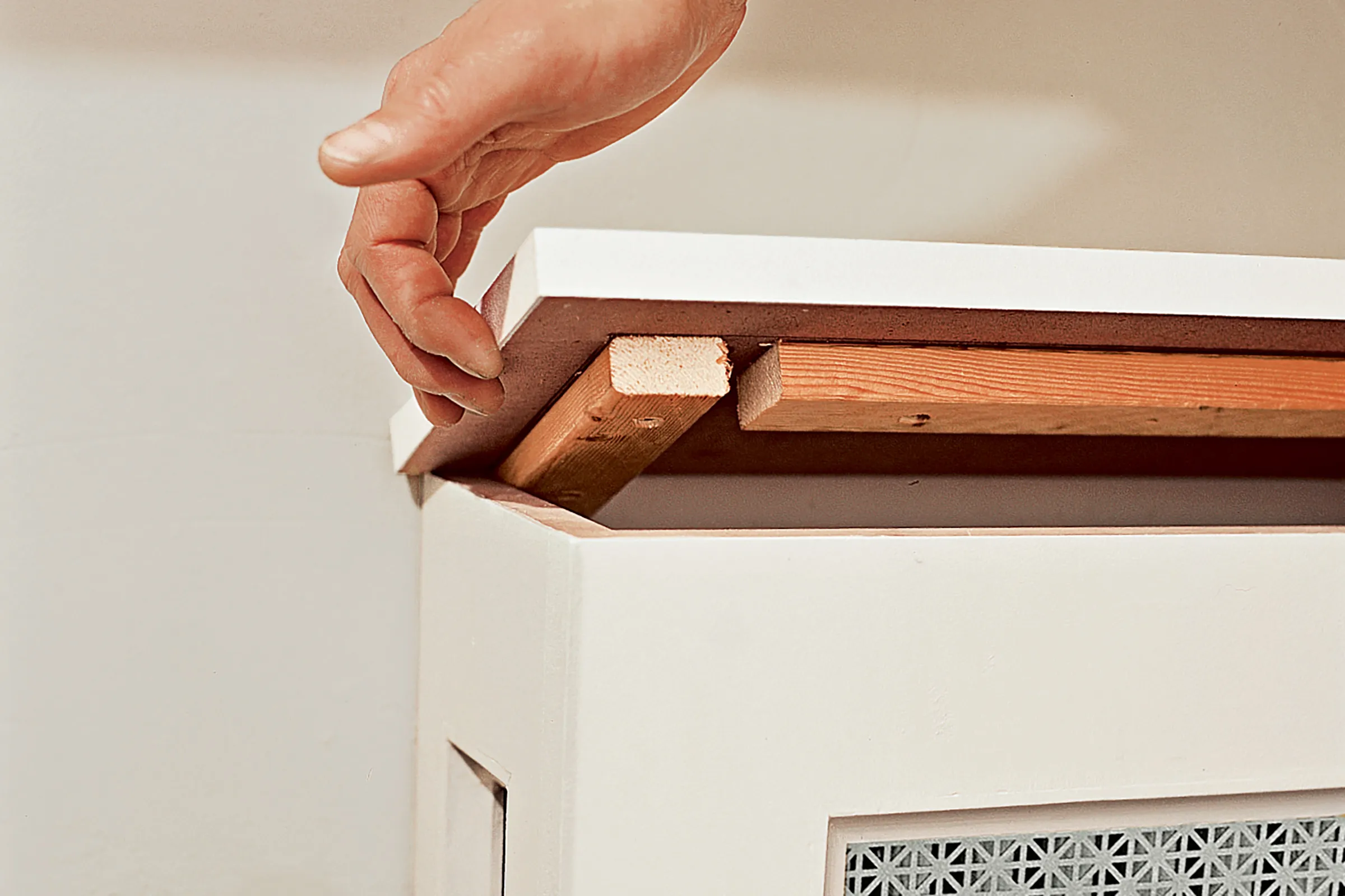 Image of step 7 of the DIY Radiator Cover Cabinet project, which involves finishing the cover's top