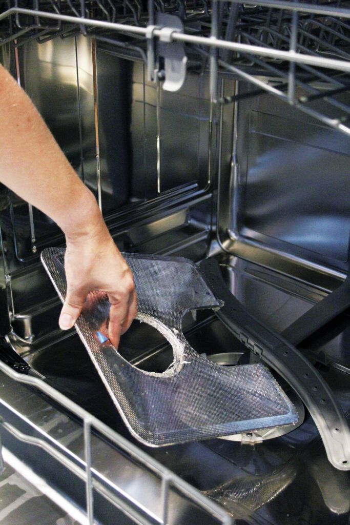 Cleaning a dishwasher to prepare for fall.