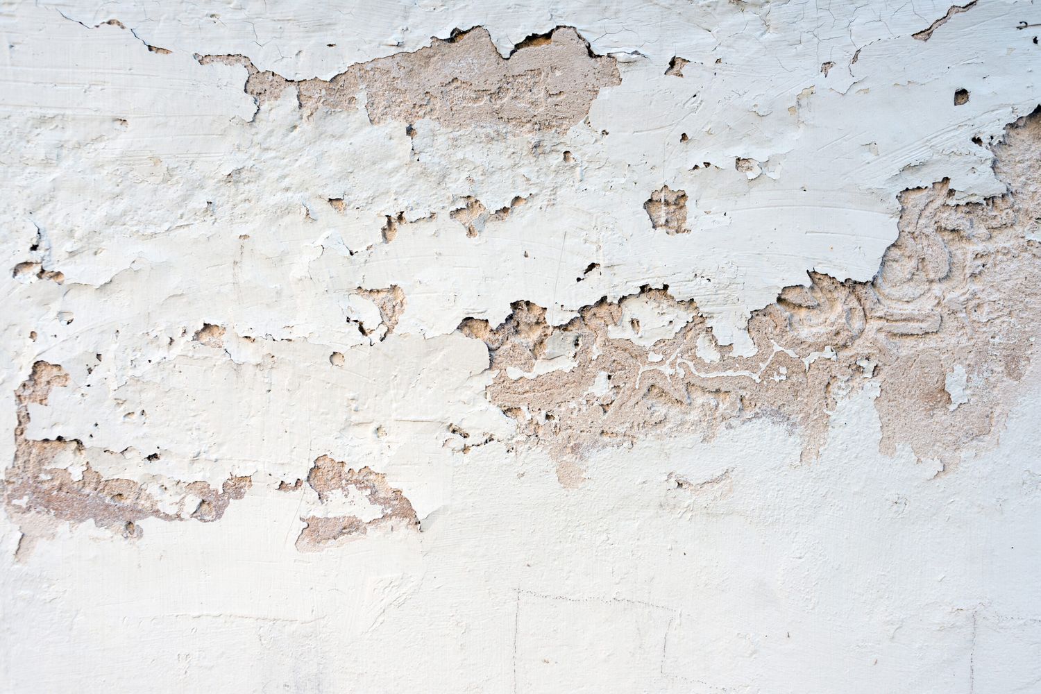 cracked paint on a concrete wall