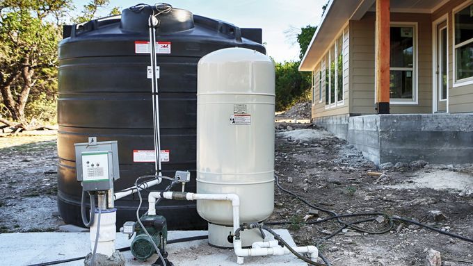 A water storage tank outside of a home.