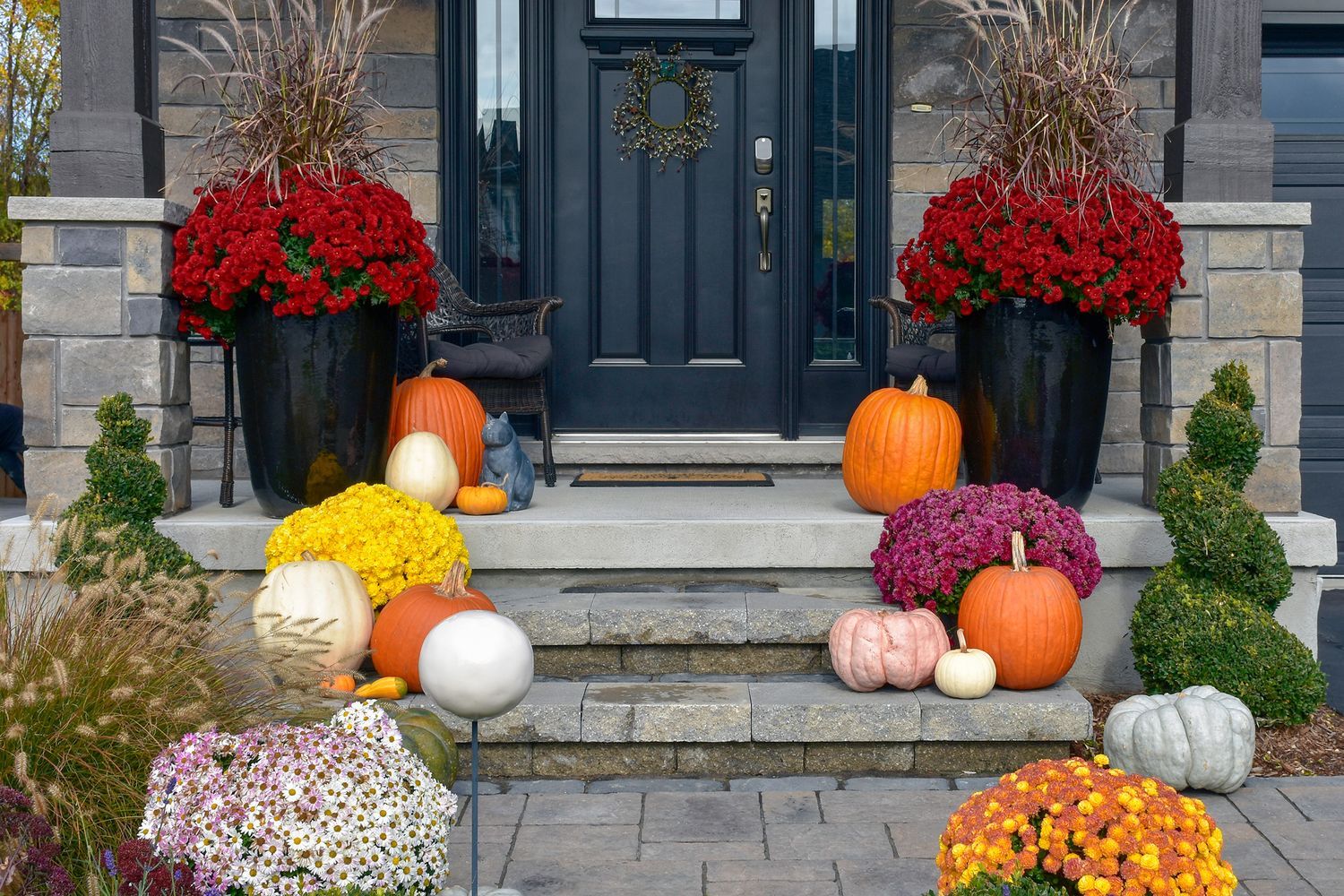 Porch decorated for fall.