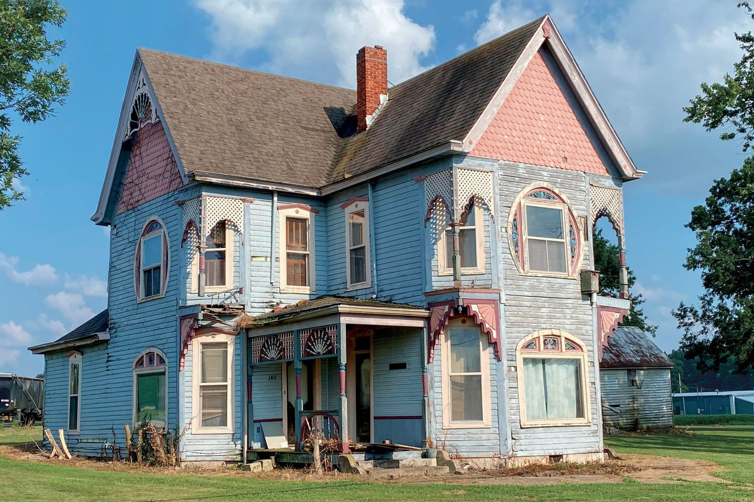 The front of a colorful victorian house