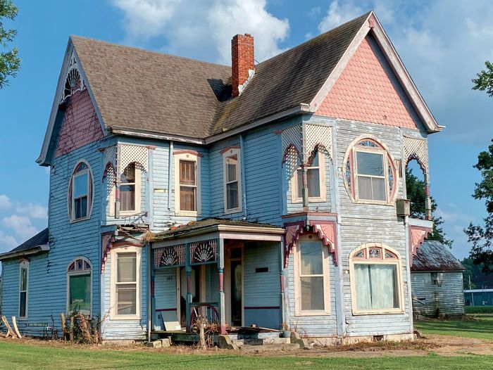 The front of a colorful victorian house