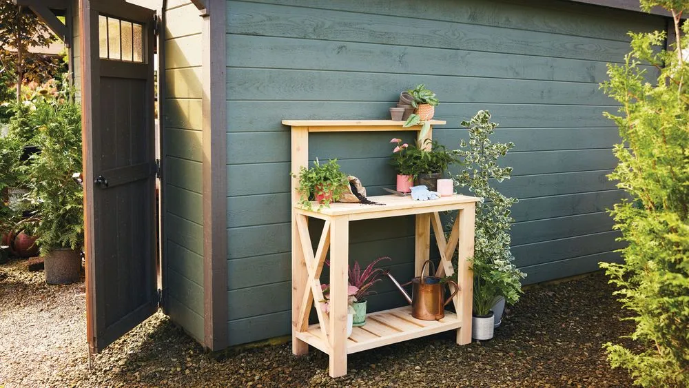 A finished potting bench next to a shed.