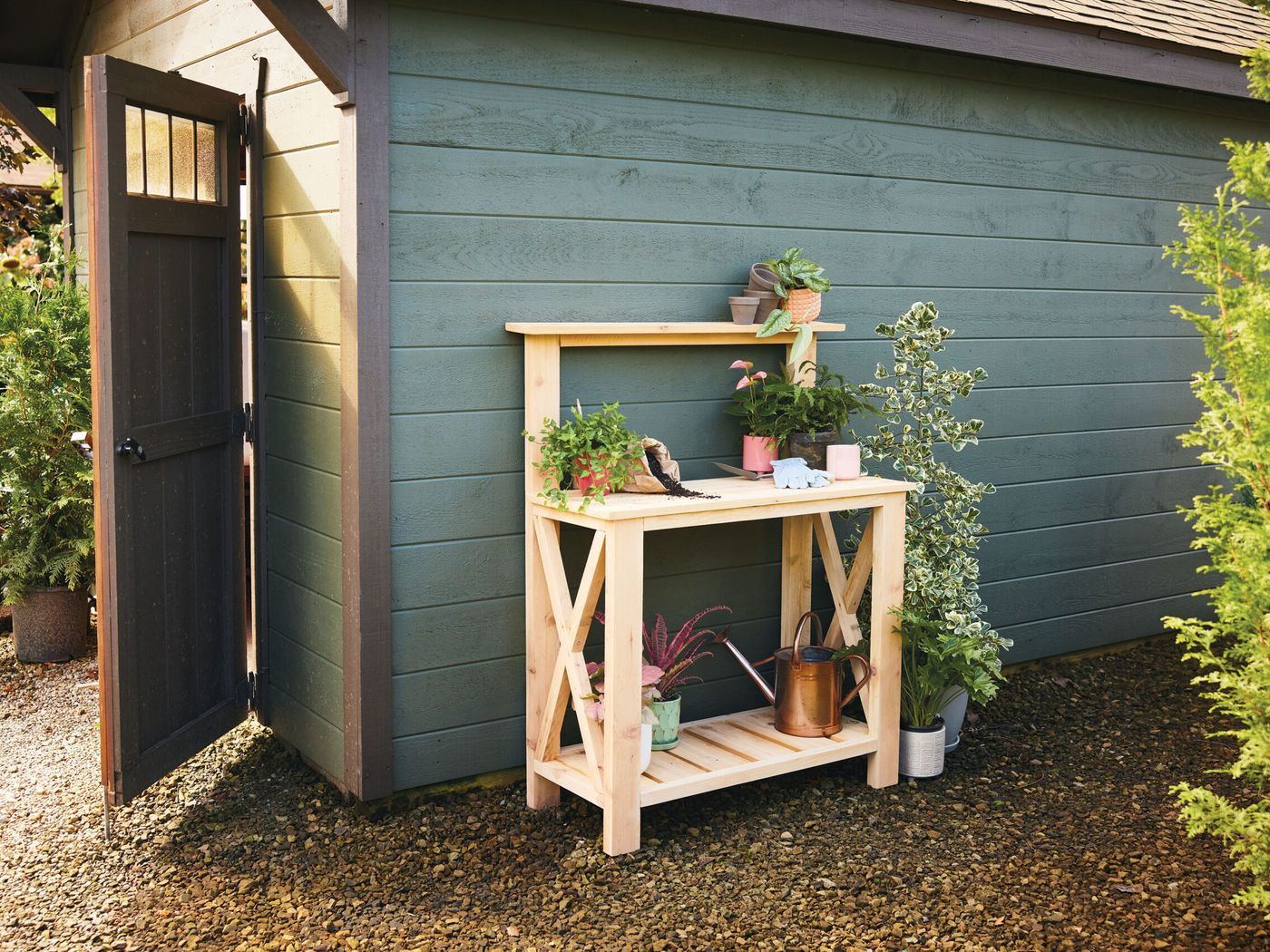 A finished potting bench next to a shed.