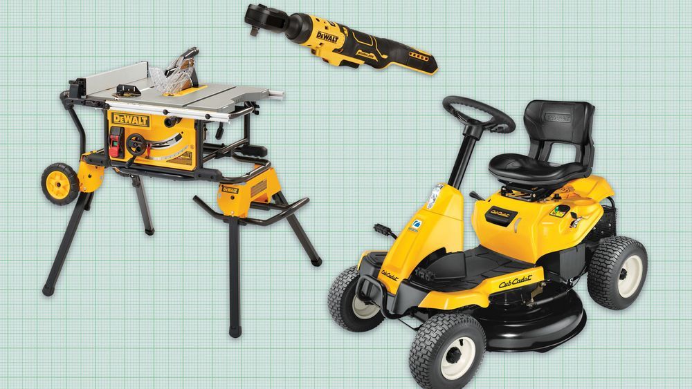 Three Dewalt tools on a green background