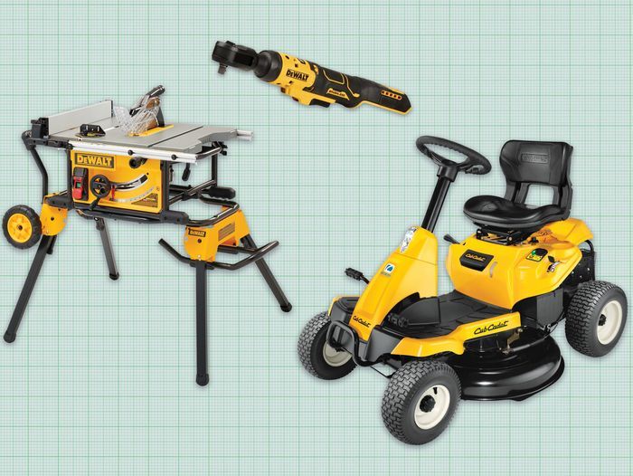 Three Dewalt tools on a green background