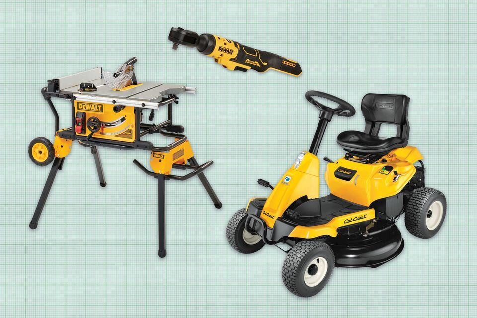 Three Dewalt tools on a green background