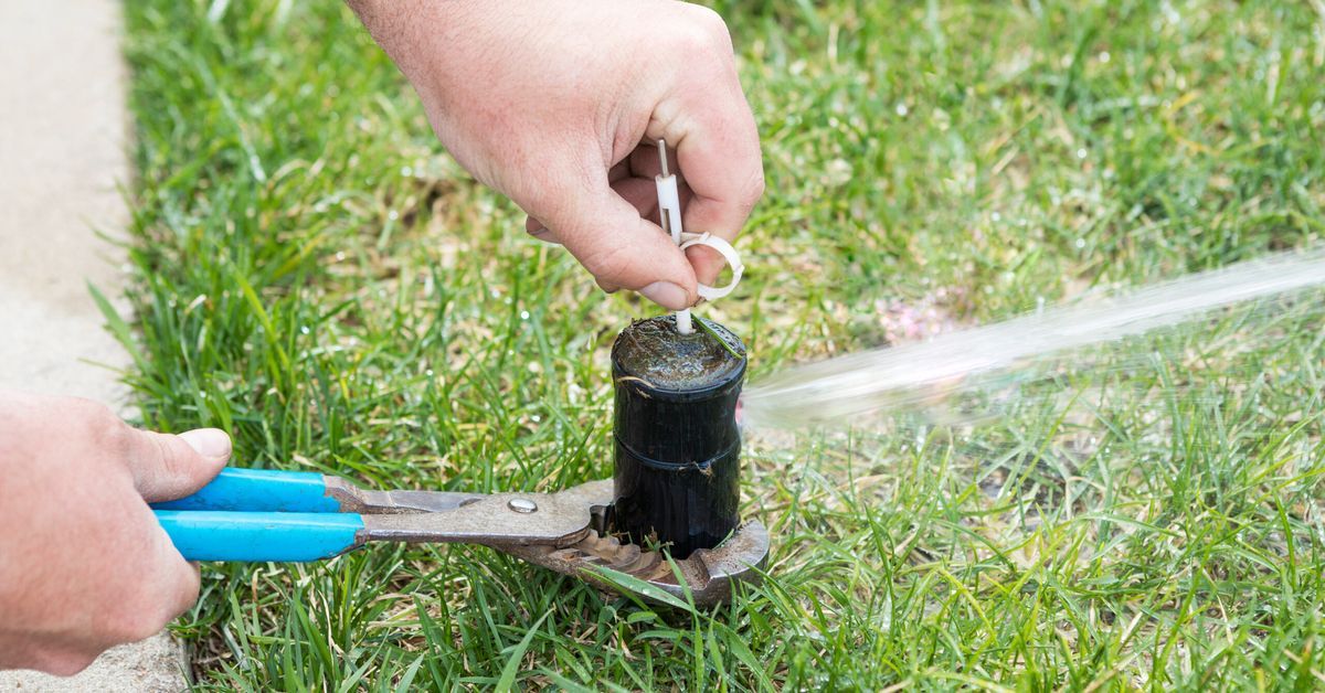 Turning on a sprinkler system with a key and pliers
