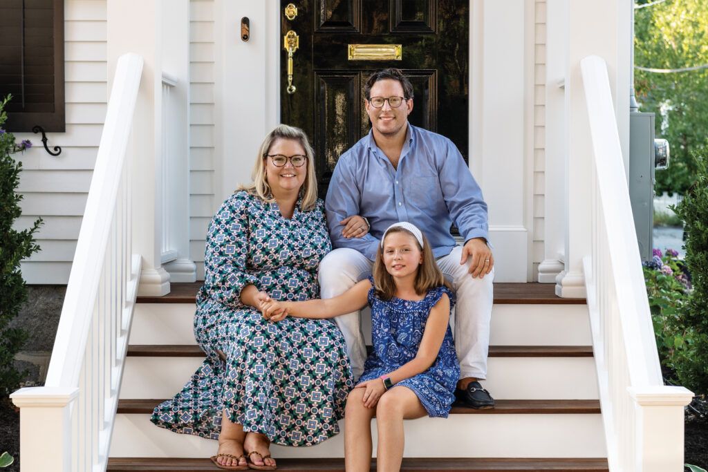 Melissa and Palen Schwab and their daughter, Alice. Exterior of House