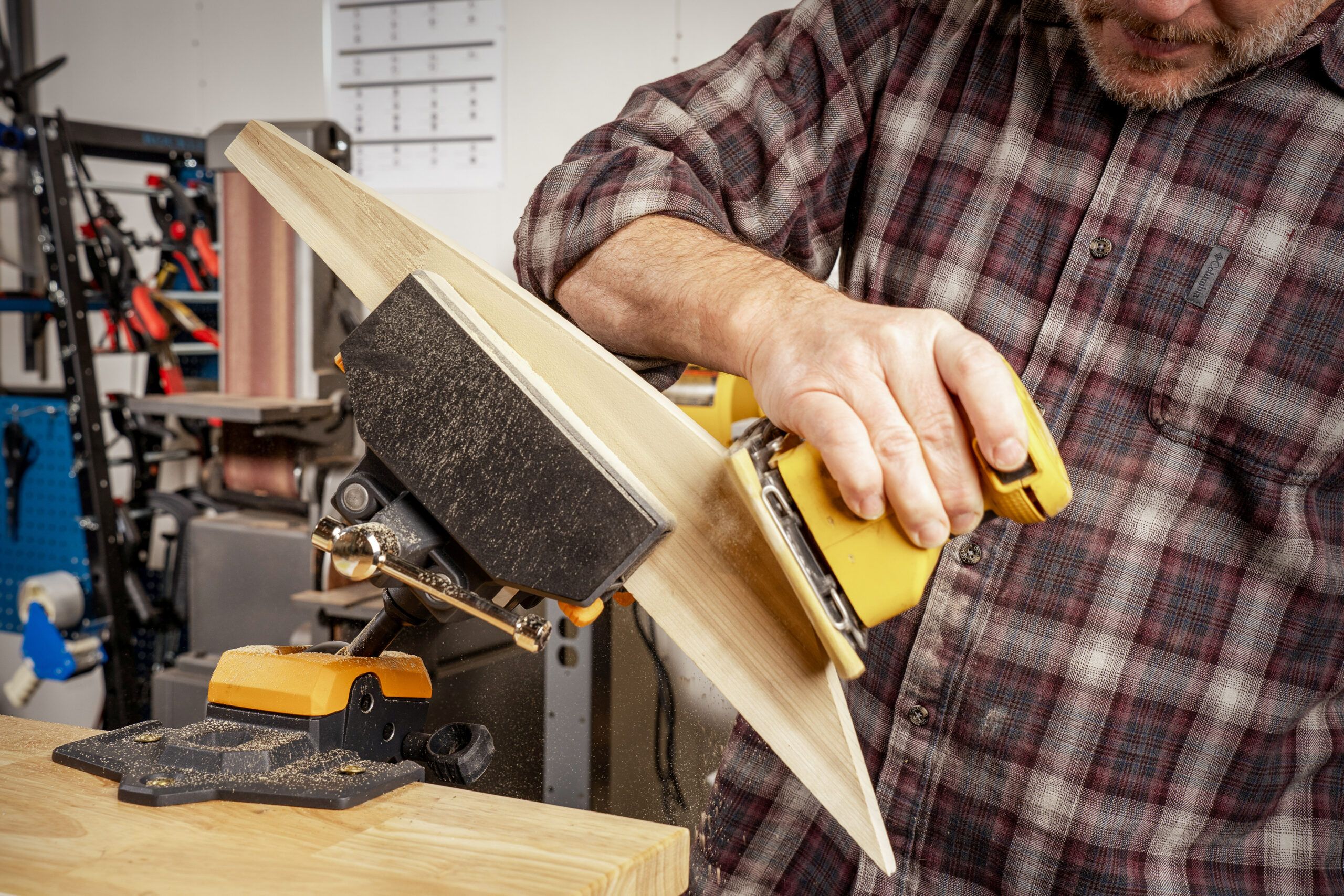 Adjustable stand holding wood