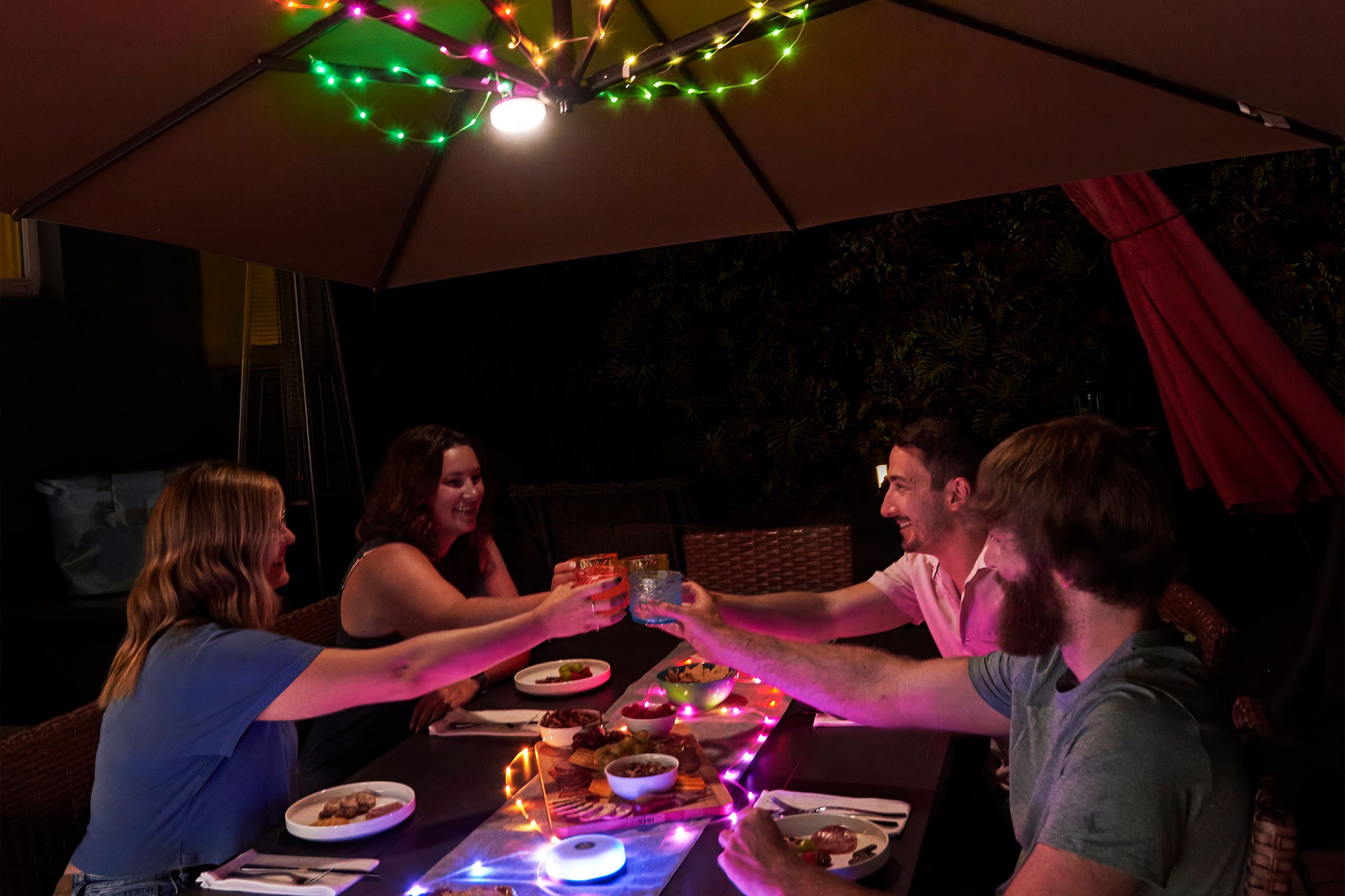 Party illuminated by string lights