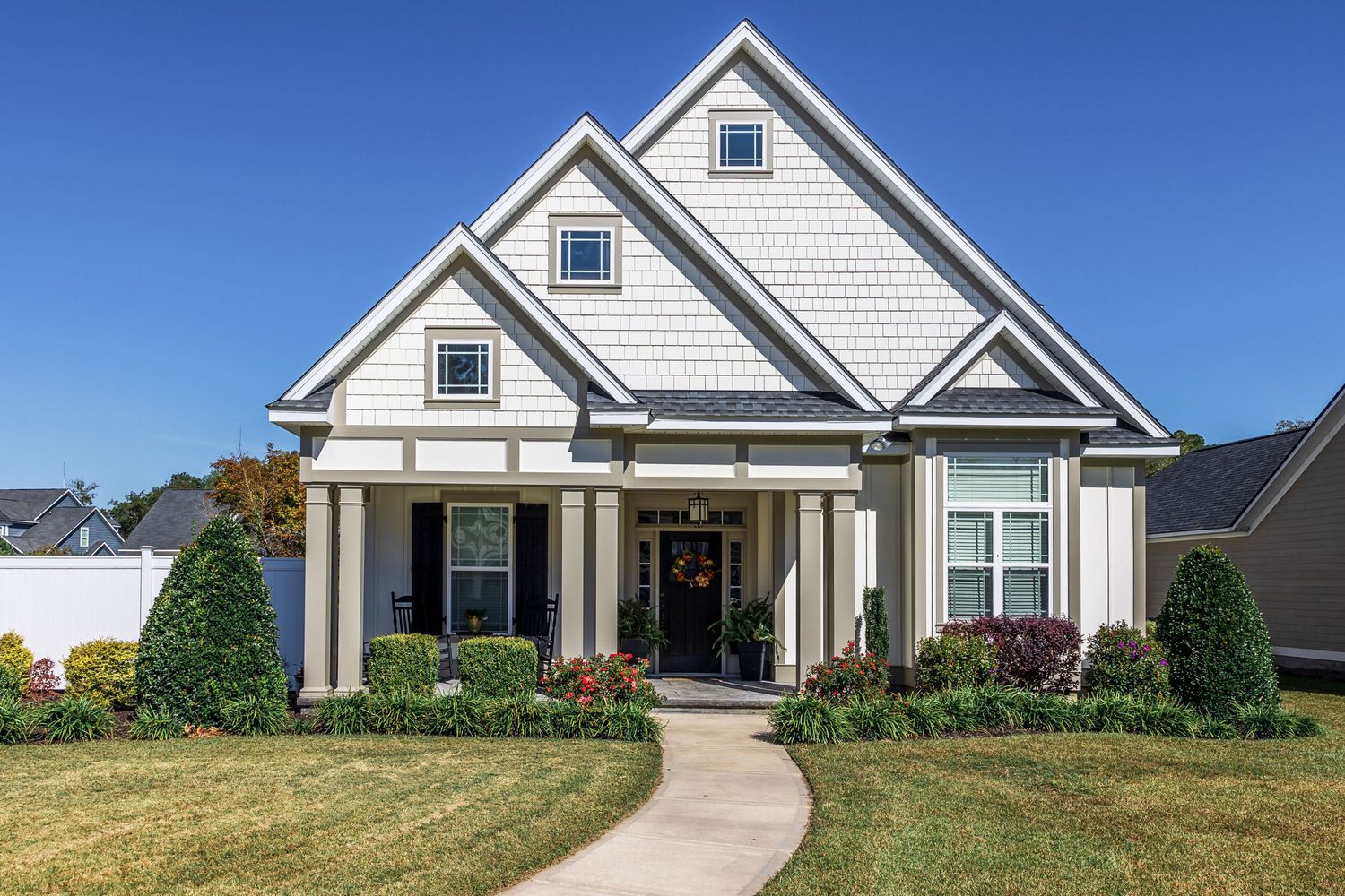 House with yellowing grass