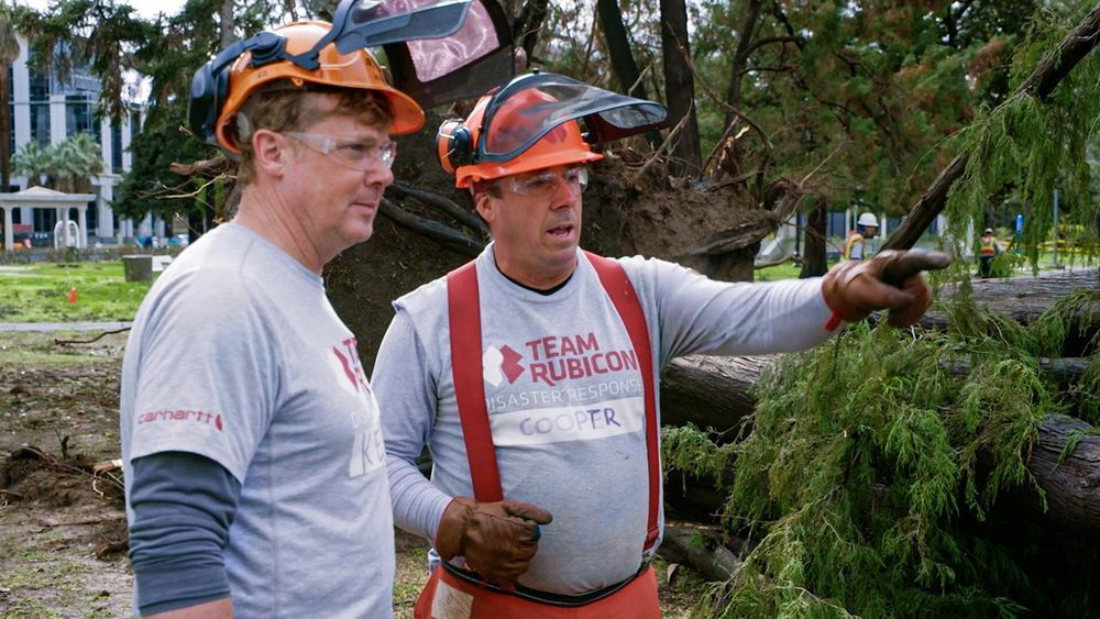 Kevin O'Connor talks to a chainsaw expert