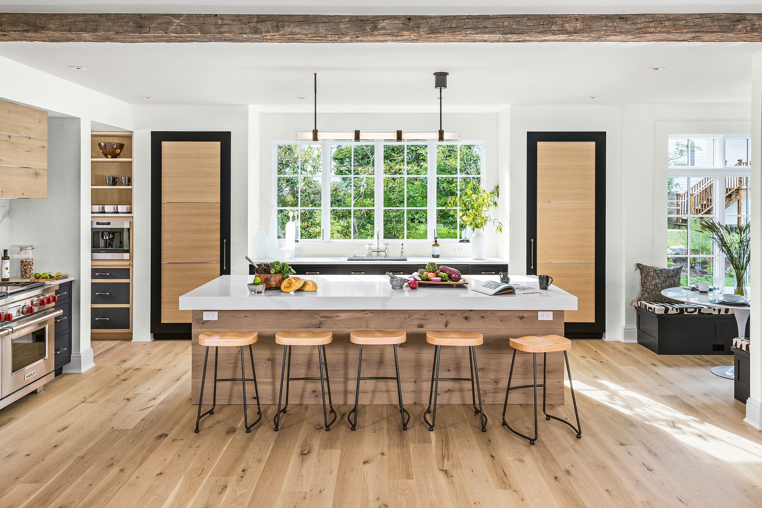 Kitchen Island with a long lighting fixture over it