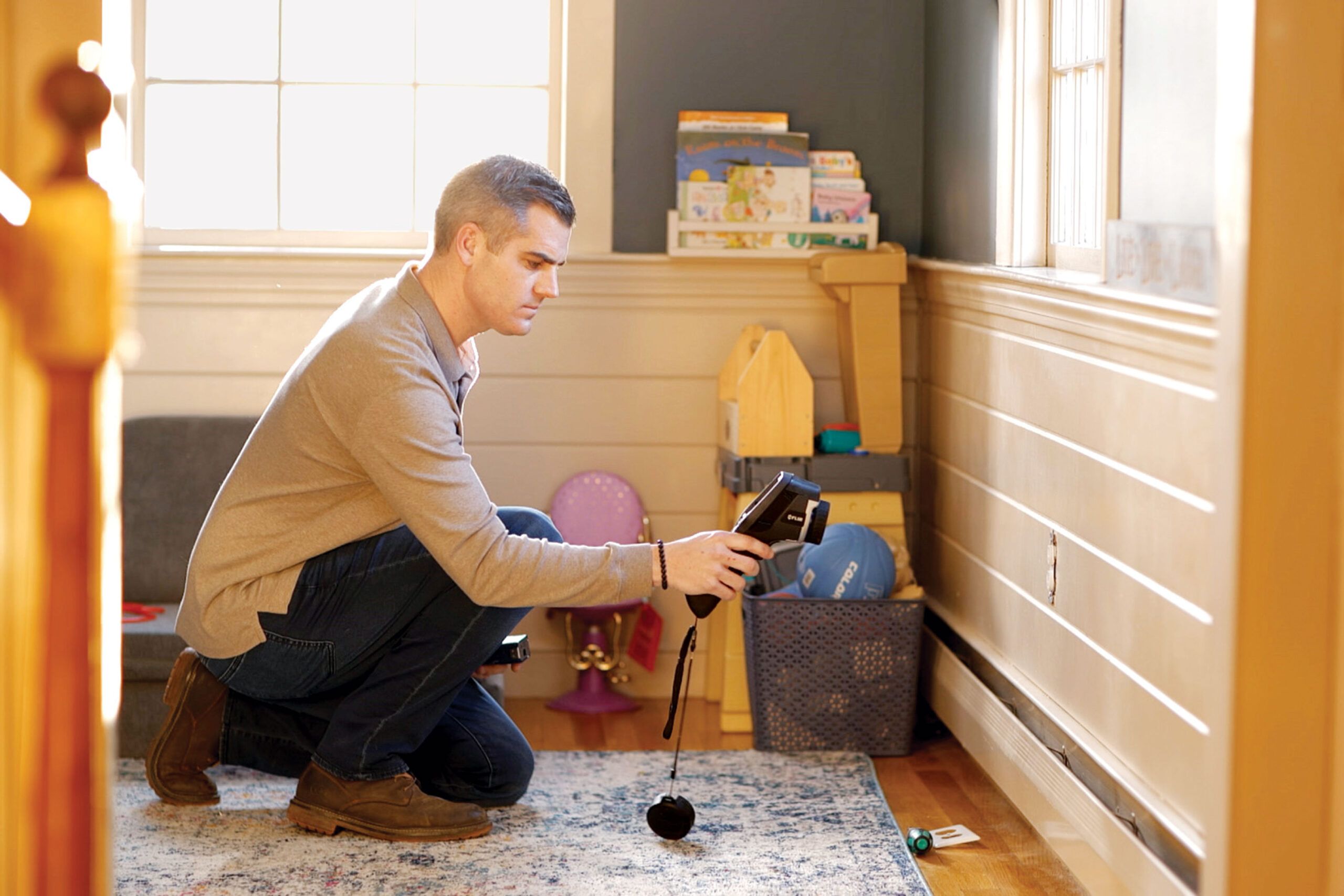 Ross uses a thermal imaging camera to detect voids in insulation, which undermine heat-pump performance.