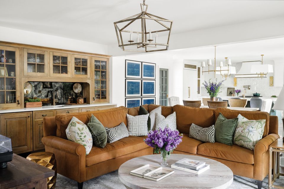 Living room with a leather couch and marble table