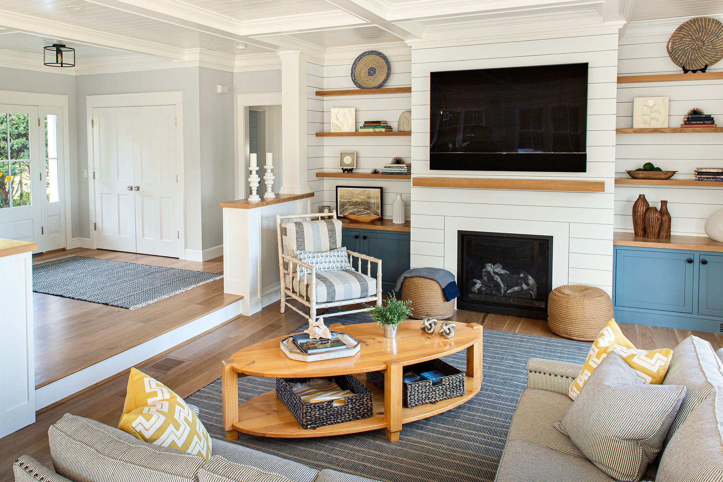 Floating bookshelves surrounding a fireplace