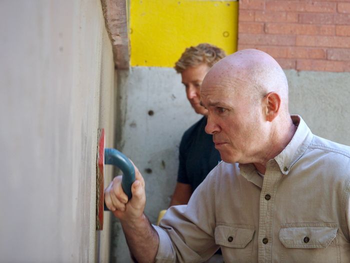 Mason Mark McCullough works on a home's concrete foundation.
