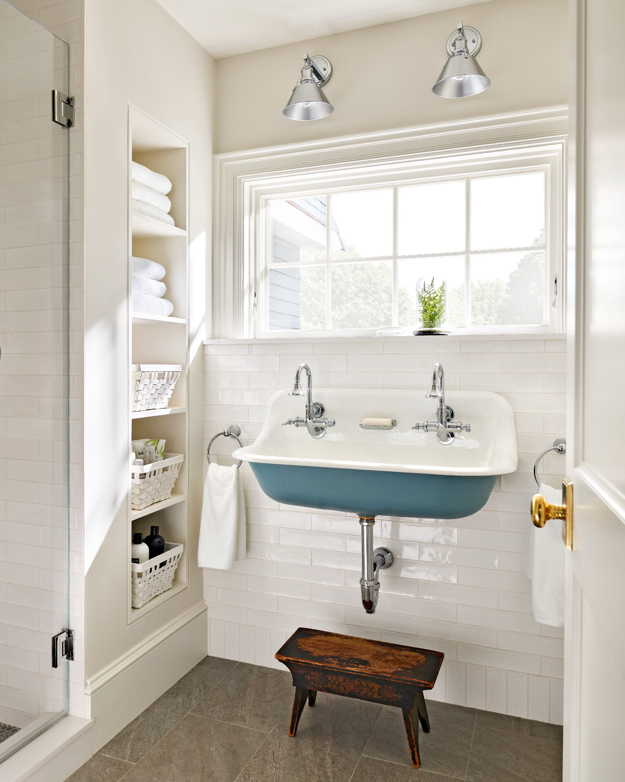 A small bathroom with a large window