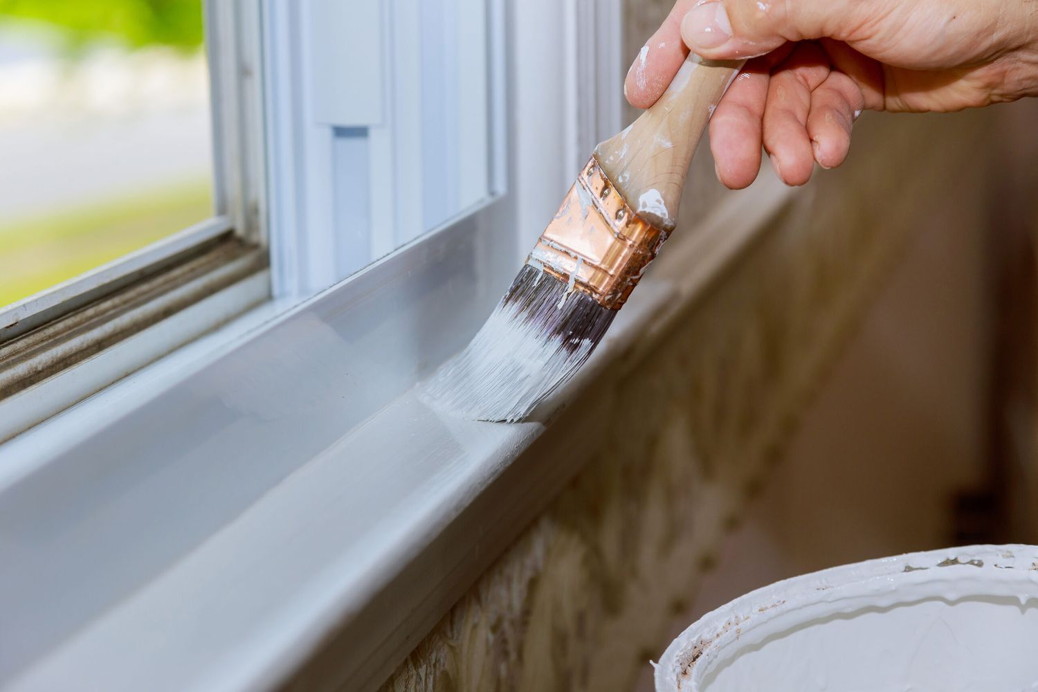 Painting trim of a window