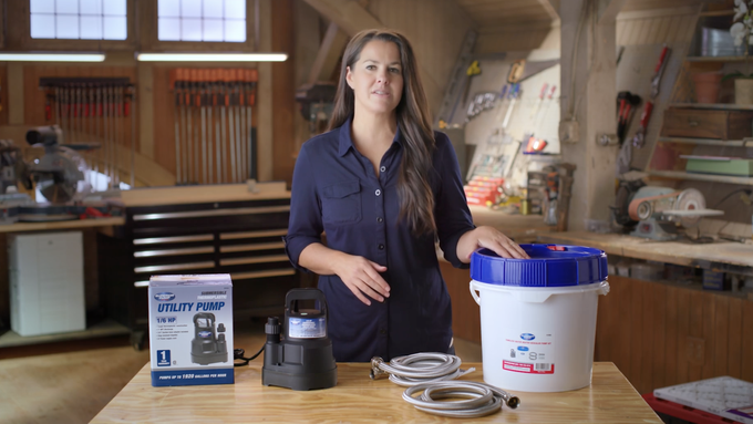 Jenn Largesse shows a tankless water heater kit.