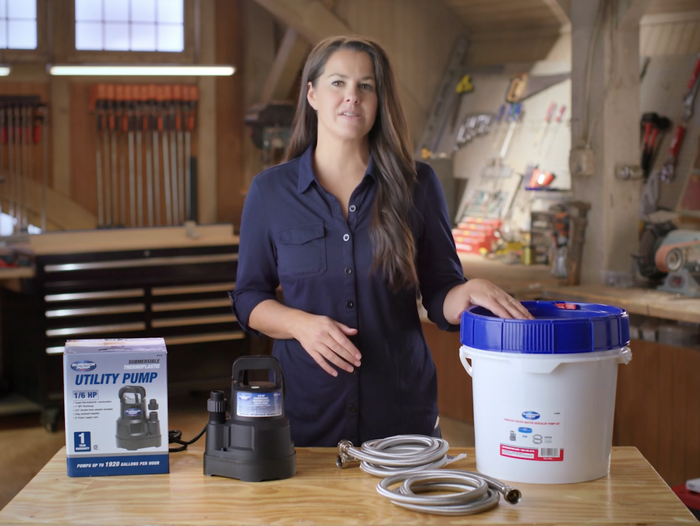Jenn Largesse shows a tankless water heater kit.