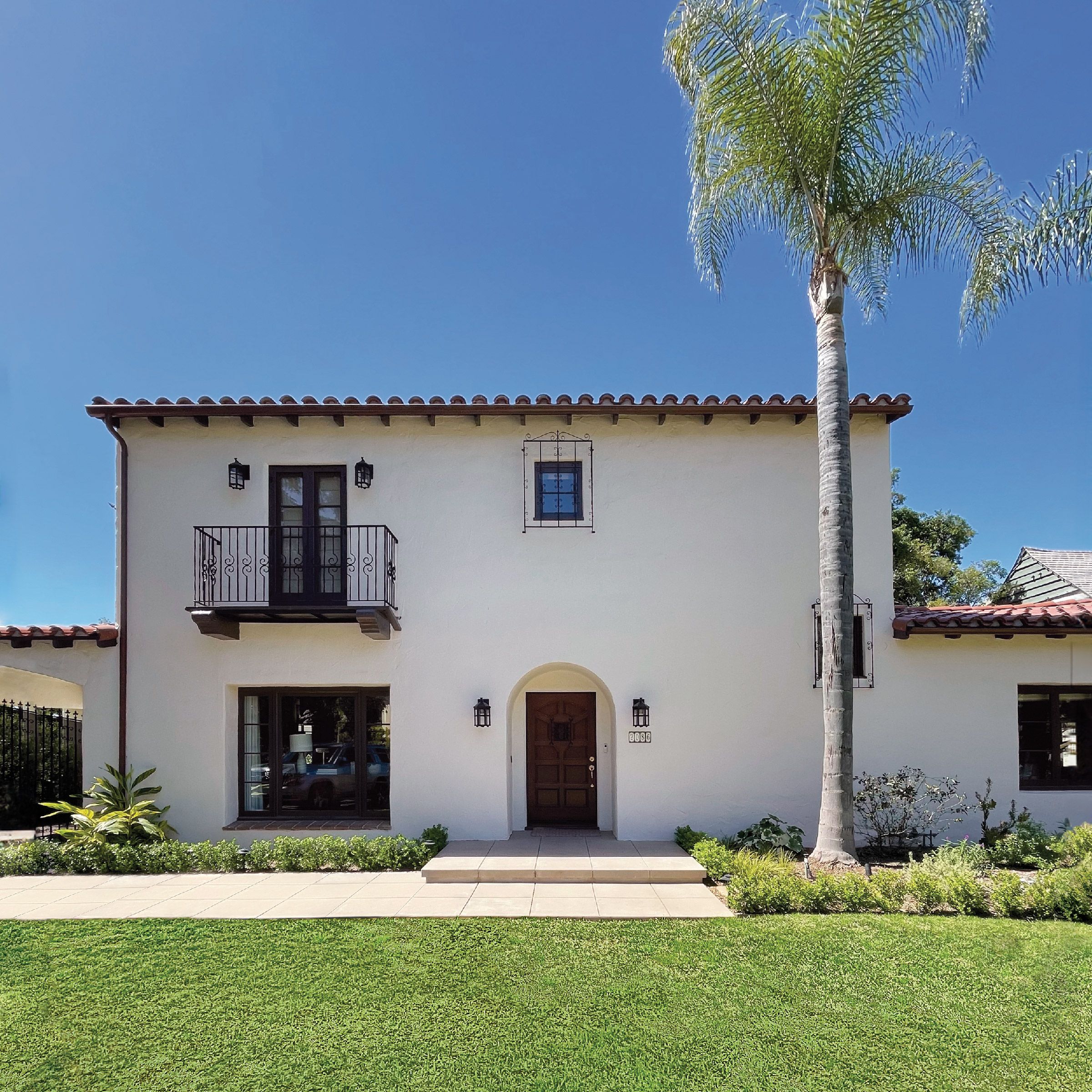 Exterior of spanish revival house with palm tree