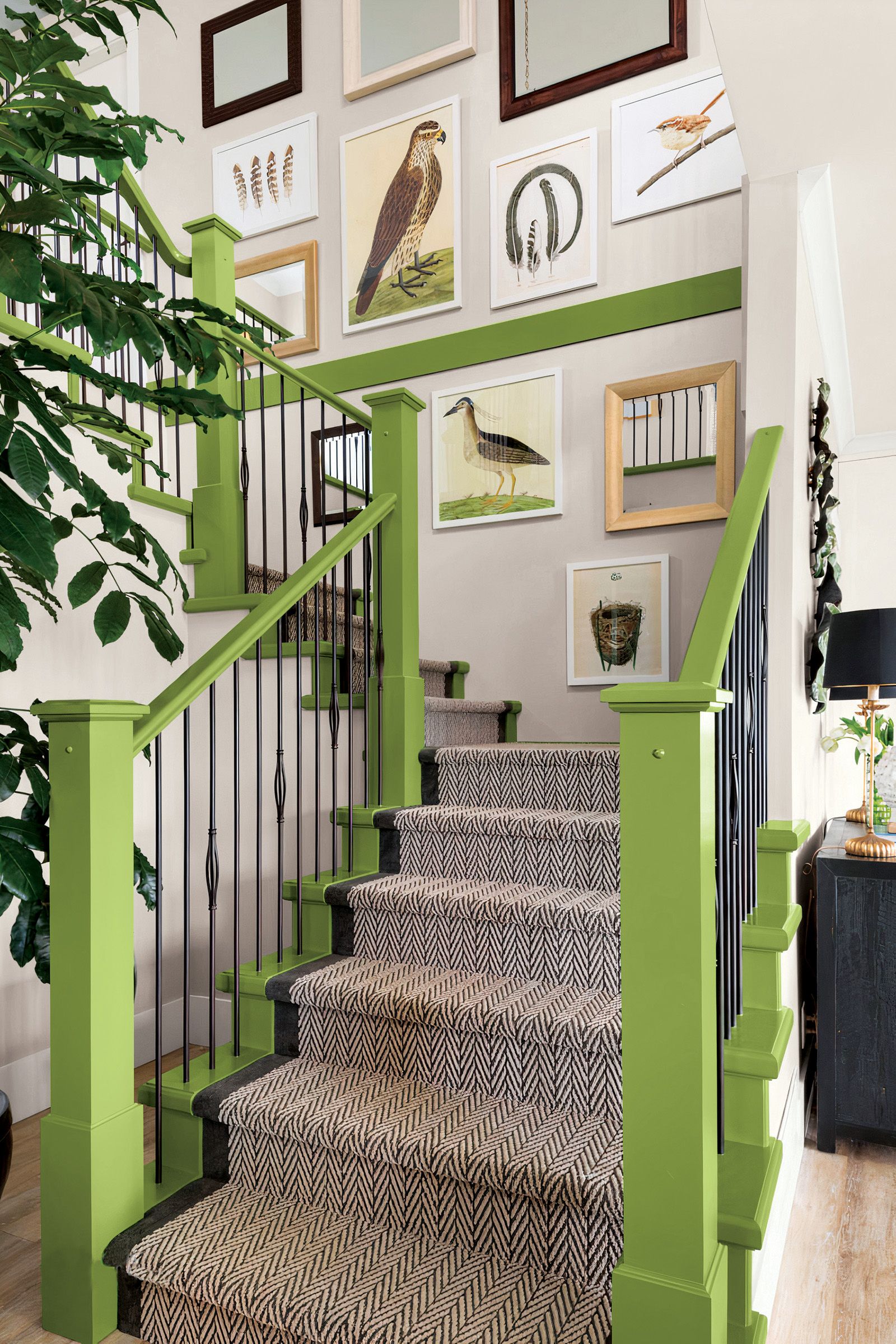 Highly decorative stairway with lime green paint on the banisters