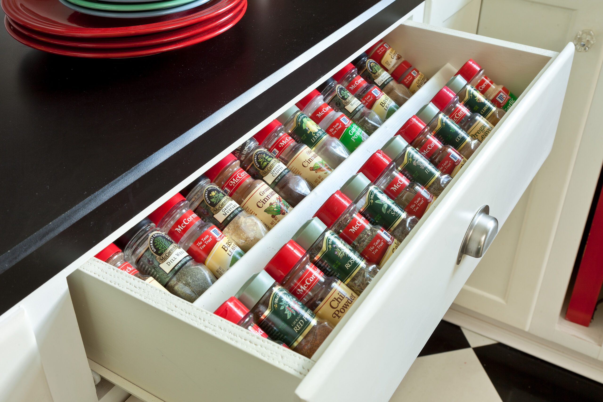 Spices neatly stacked in a kitchen drawer