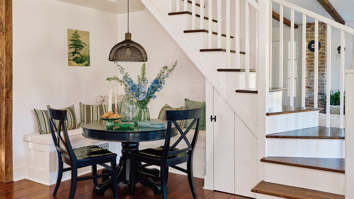 Dining nook on the side of the house stairs