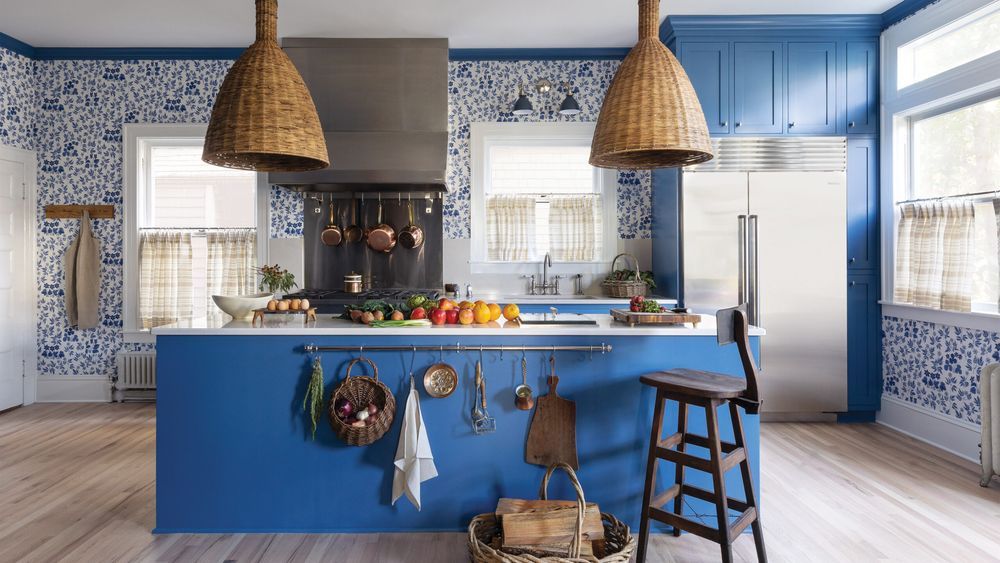 blue kitchen with large wicker pendants