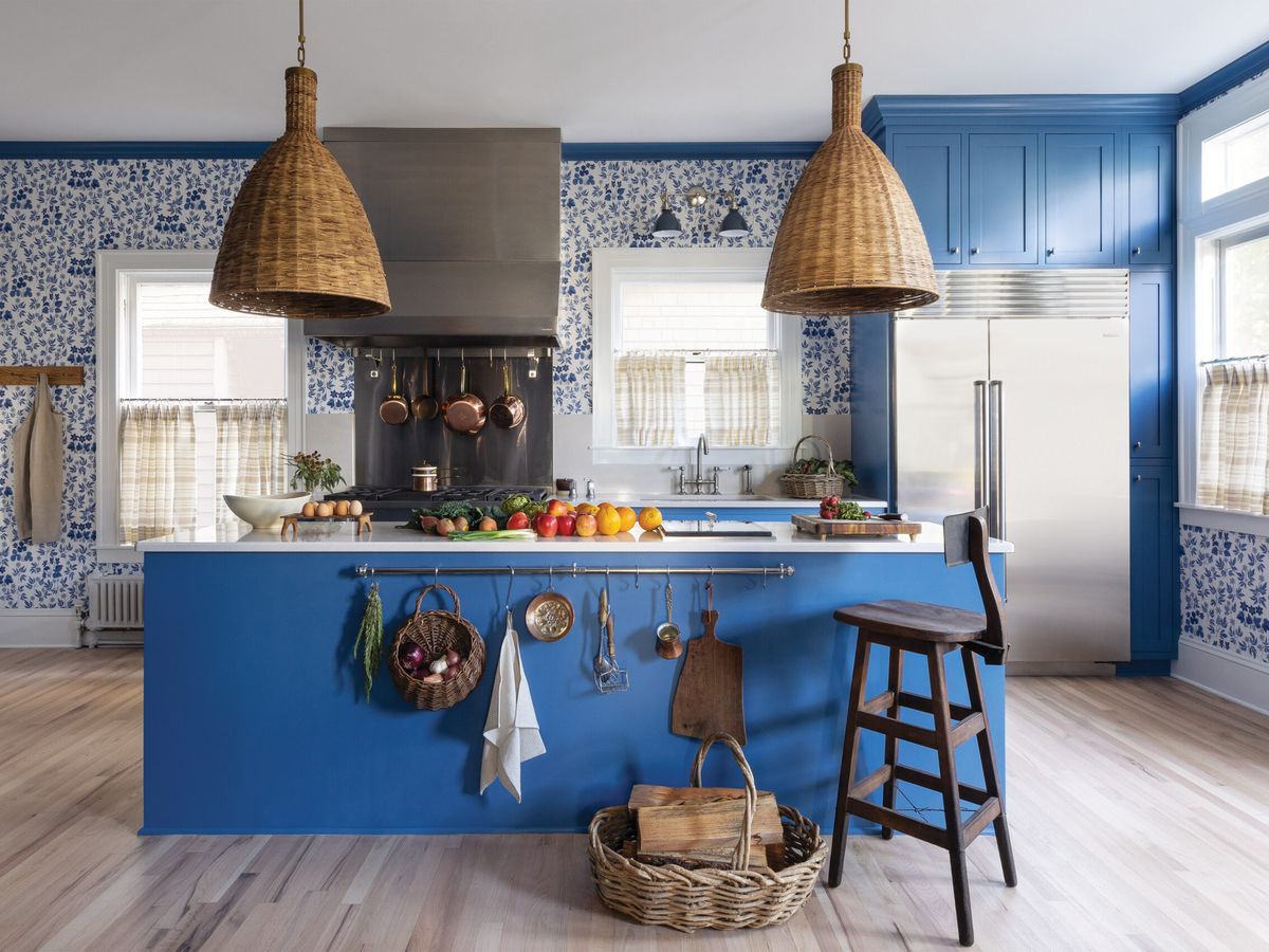 blue kitchen with large wicker pendants