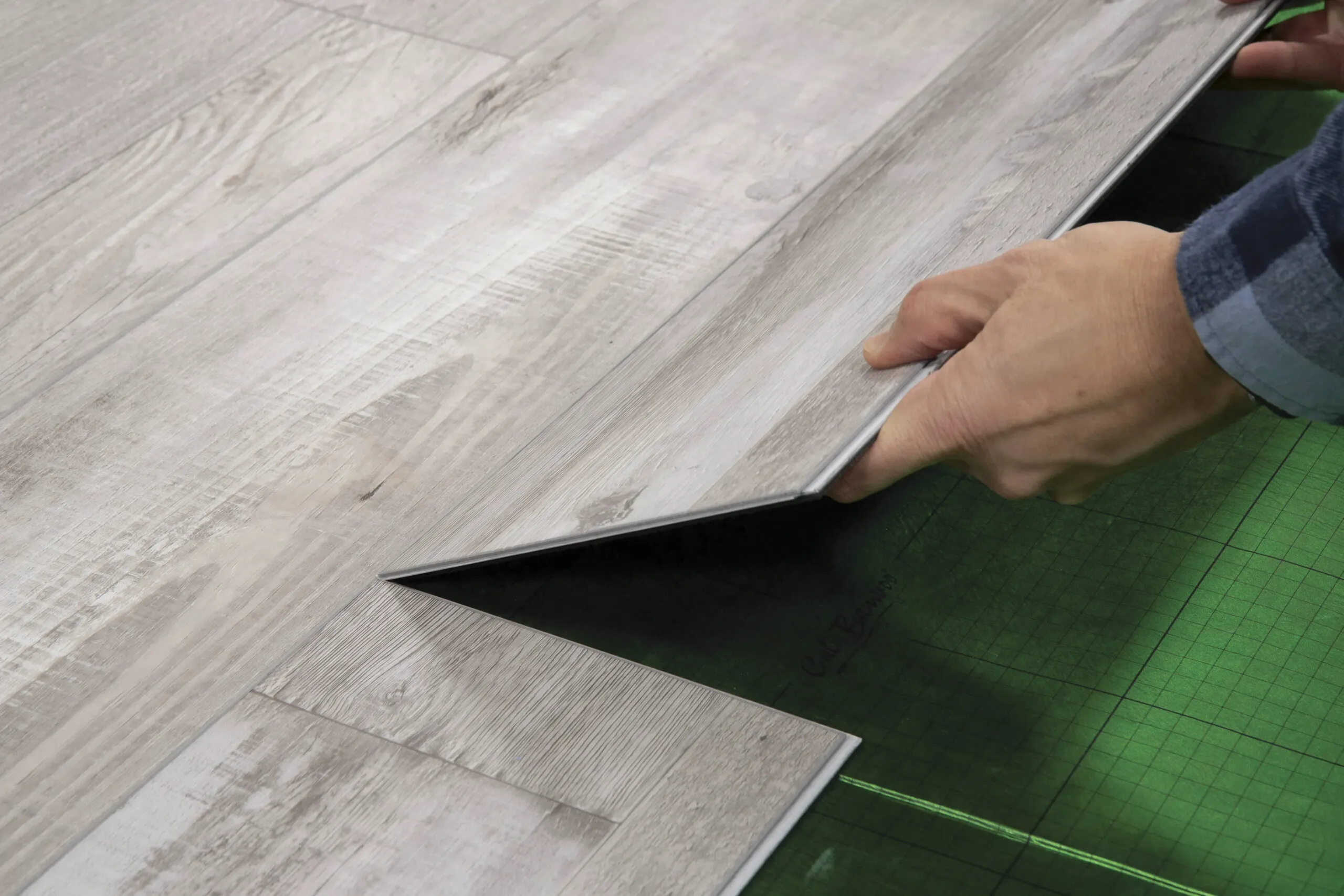 Installing a floating vinyl floor.