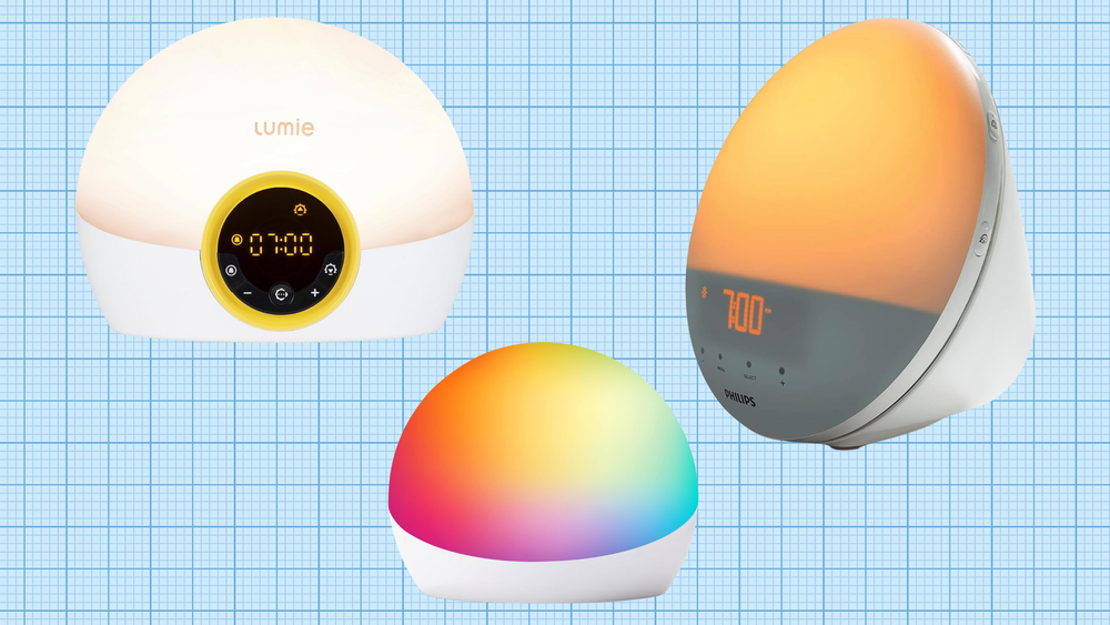 Philips SmartSleep Wake-up Light, Lumie Bodyclock Rise 100 Alarm Clock, and Amazon Echo Glow Multicolor Smart Lamp isolated on a grid paper background