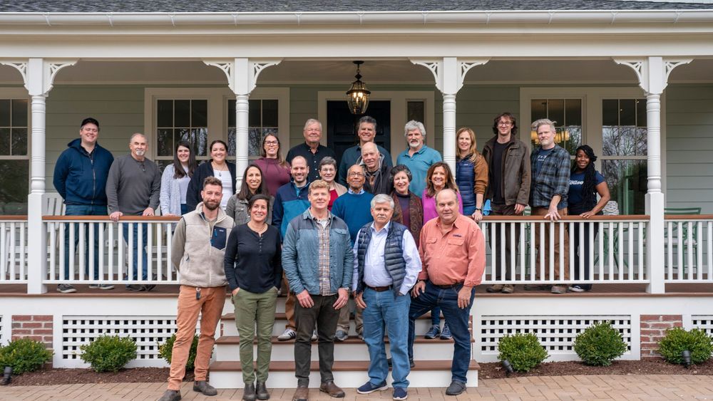 Cast and crew of TOH standing on the porch of the Glen Ridge House
