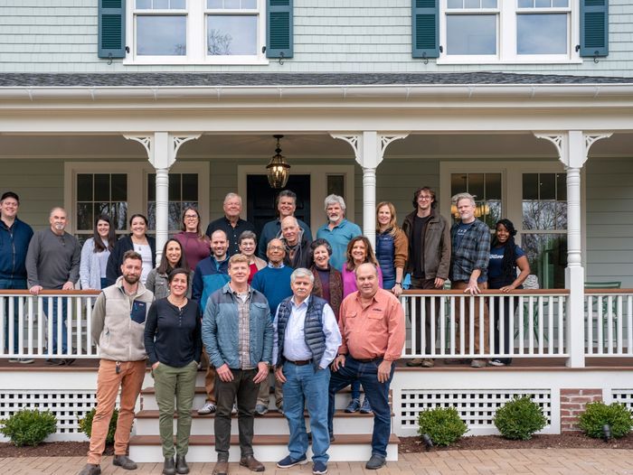 Cast and crew of TOH standing on the porch of the Glen Ridge House