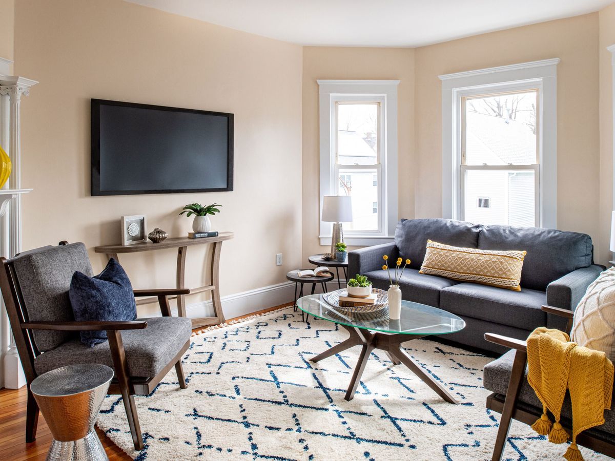 Living Room with small furniture and mounted TV