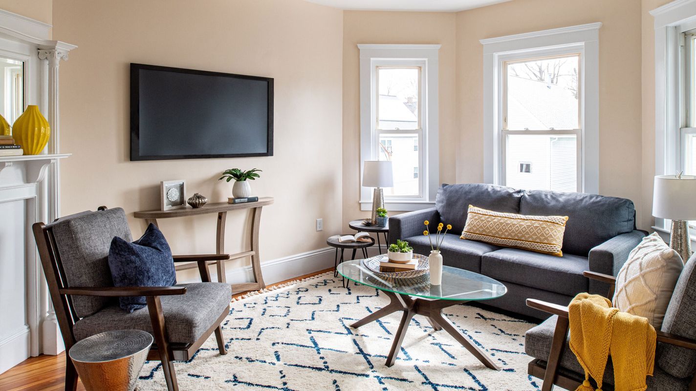 Living Room with small furniture and mounted TV