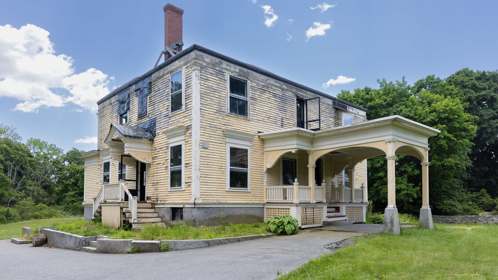 Colonial house with fire damage in Westford MA