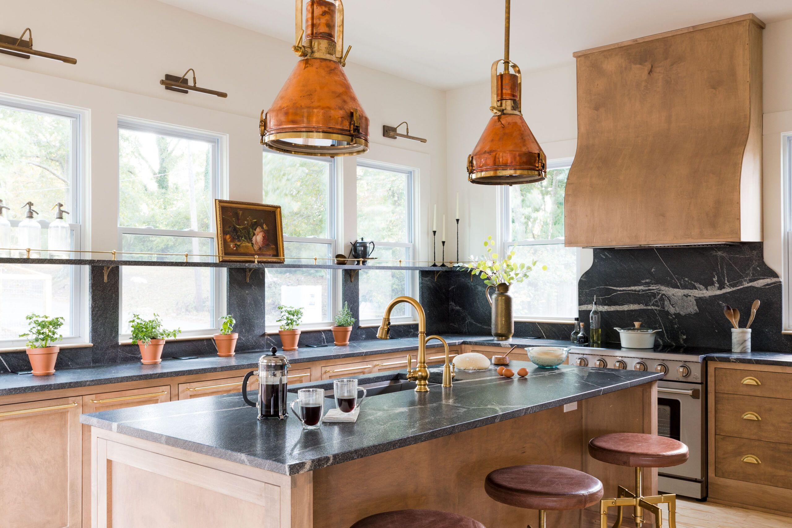 Kitchen with a marble shelf that goes across the windows