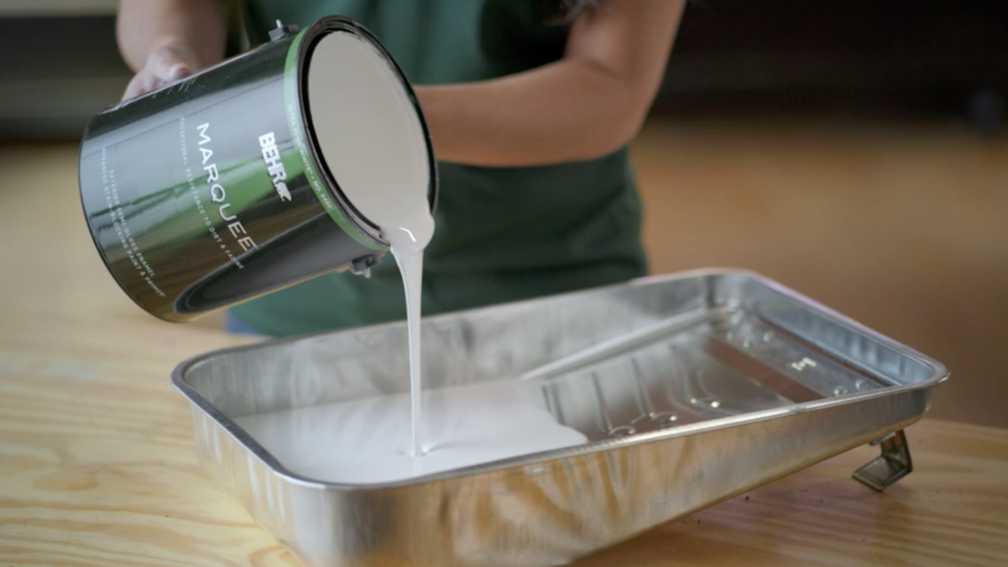 Pouring paint into a tray