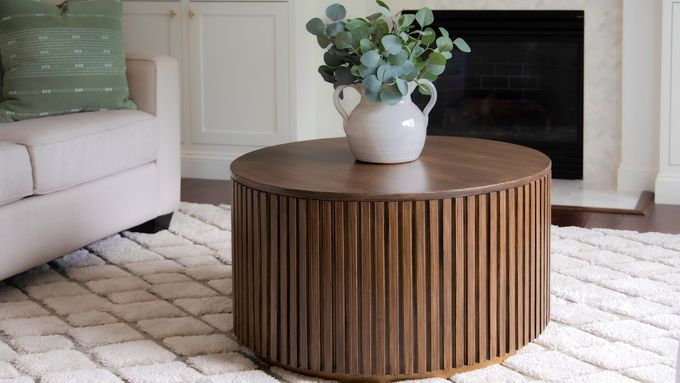 Round slatted coffee table in a living room