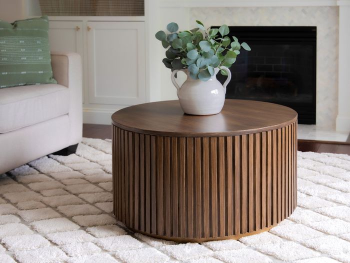 Round slatted coffee table in a living room