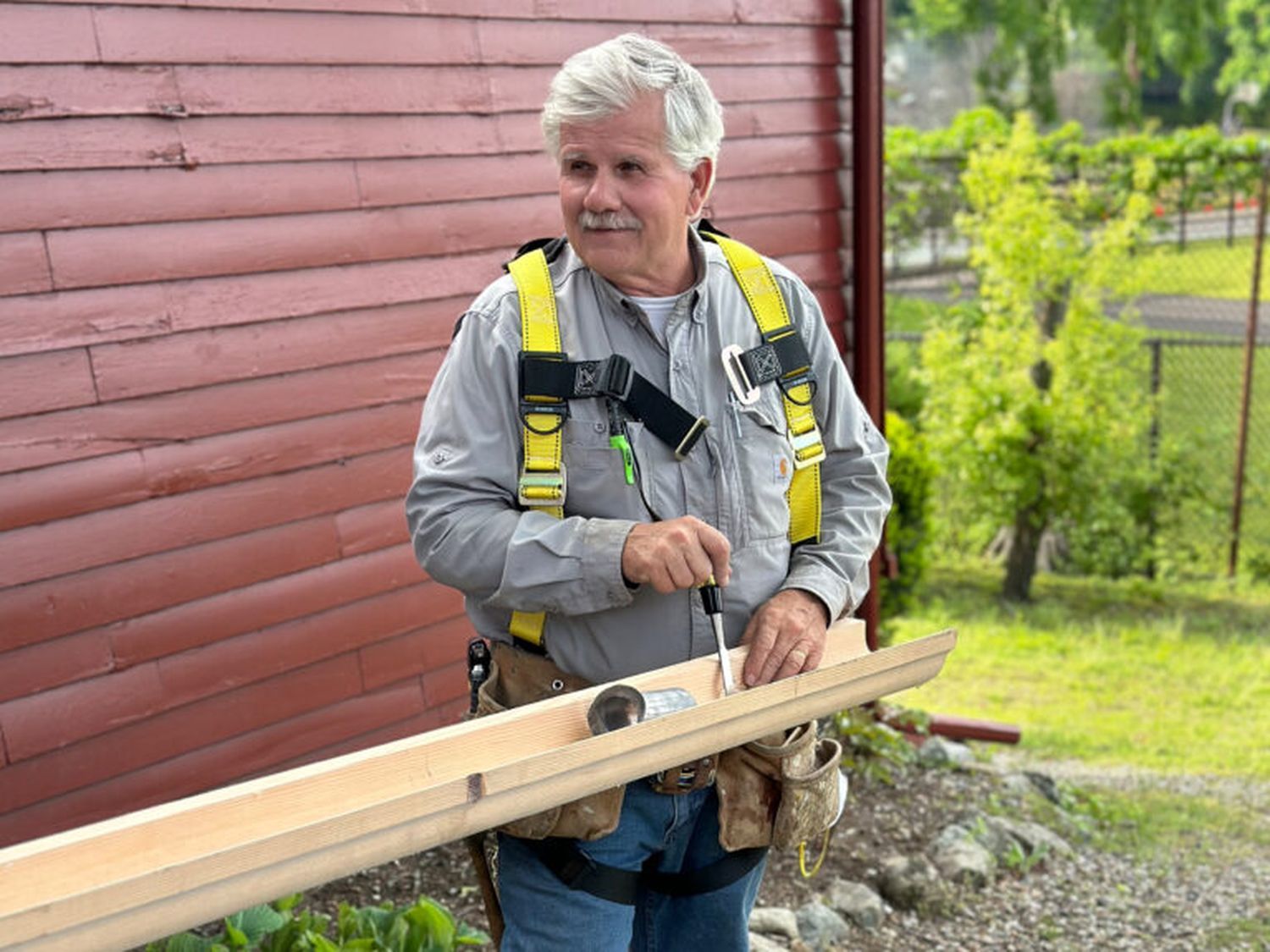 Tom Silva repairing a wooden gutter