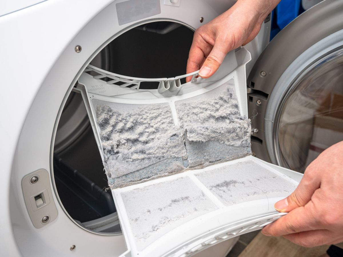 Emptying a lint trap on a dryer