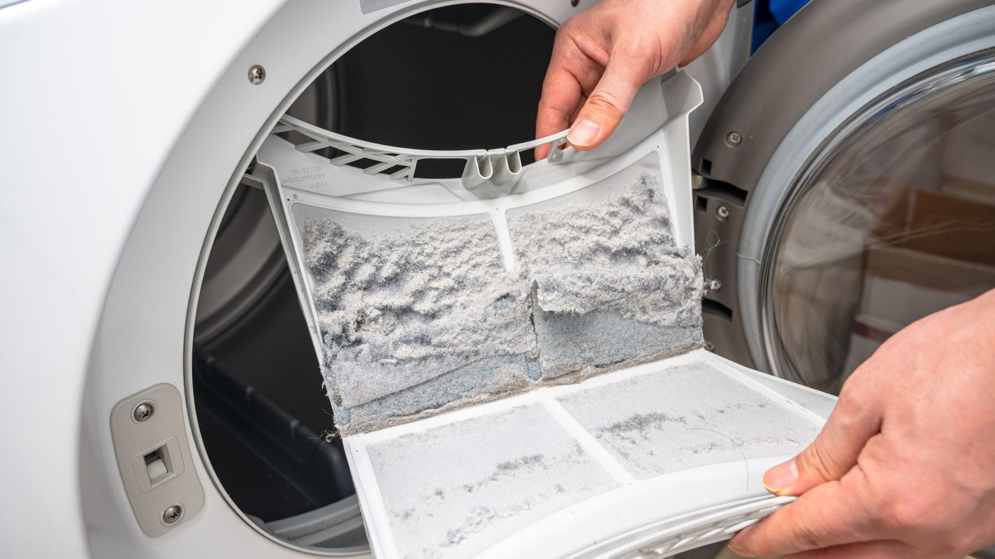 Emptying a lint trap on a dryer