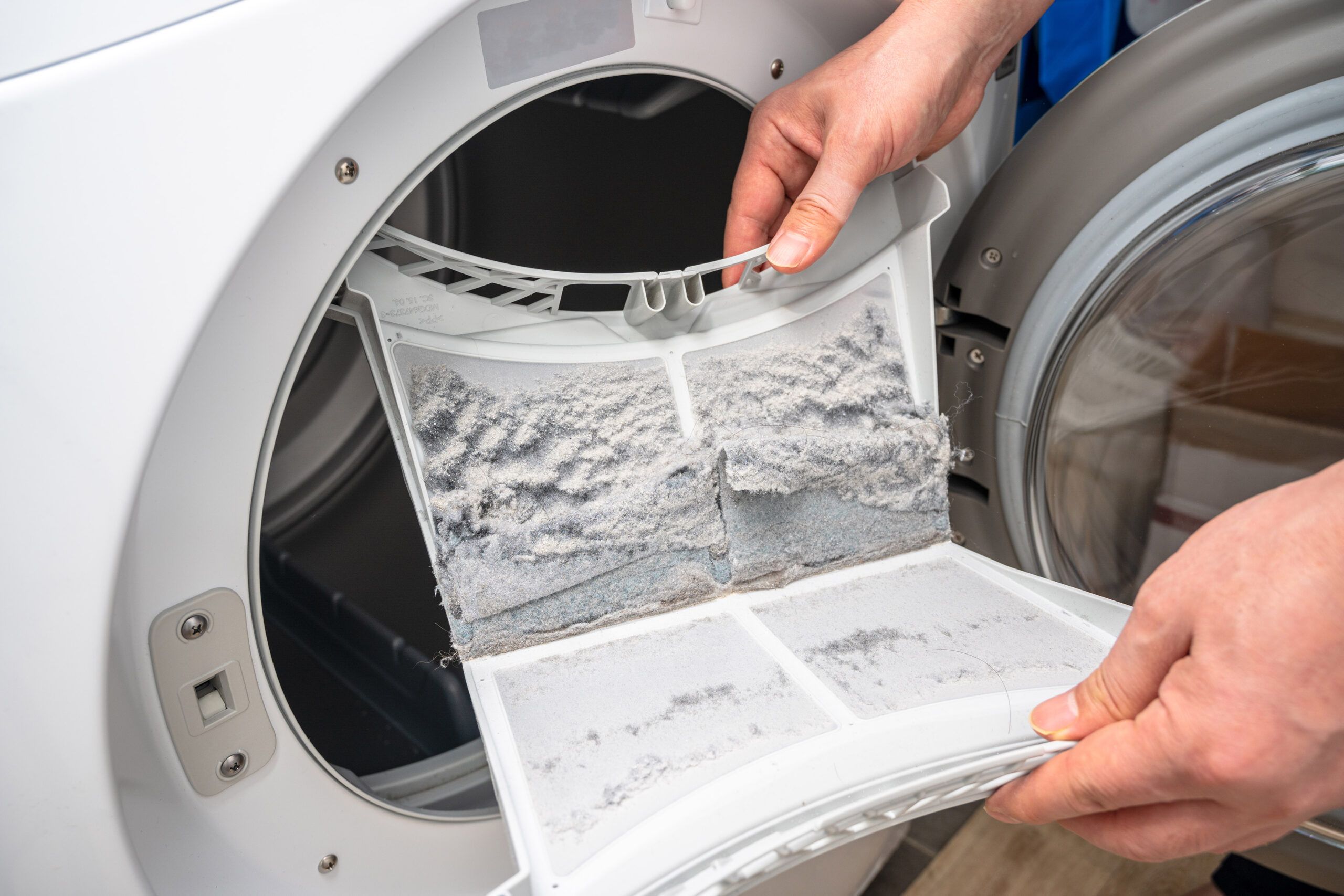 Emptying a lint trap on a dryer